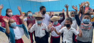 Guatemalan children waving hello